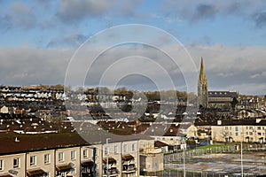 Derry, North Ireland. Aerial view of Derry Londonderry city center in Northern Ireland, UK. Sunny day with cloudy sky, city walls