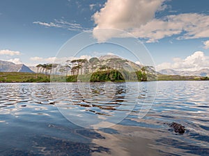 Derryclare Lough, Twelve Pines landscape,Sunny warm day, Cloudy sky, County Galway Ireland. Popular tourist destination