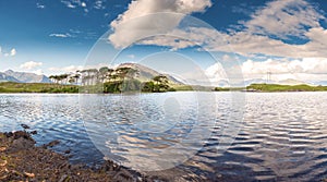 Derryclare Lough, Twelve Pines landscape,Sunny warm day, Cloudy sky, County Galway Ireland. Popular tourist destination. Panorama