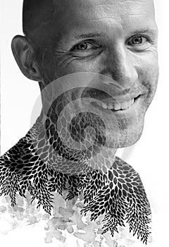 A desaturated paintography portrait of a smiling man in double exposure