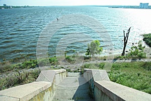 Descend stairs to river