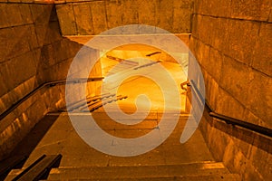 descent into a lighted underground passage
