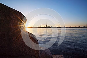 Descent to the Neva granite steps, View of the Peter and Paul fortress, St. Petersburg.