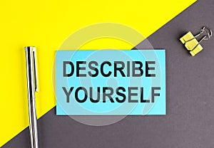DESCRIBE YOURSELF text written on sticky with pen on grey, yellow background, business concept