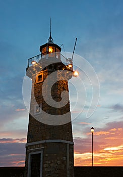Desenzano del Garda Old Lighthouse and a Lamp Post Sunrise photo