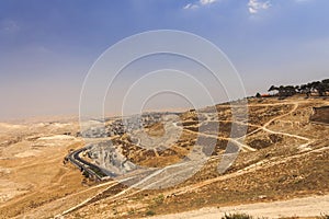 Desert area of West Bank and palestinian towns and villages behind the West Bank separation wall