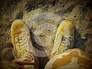 Desert boots in sandbox photo