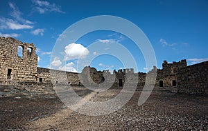 Desert castle Qasr al Azraq in eastern Jordan under clear blue s