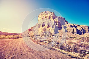 Desert dirt road at sunset, USA.