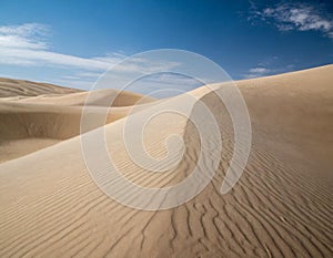 desert dunes and blue sky background