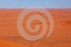 Desert. Dunset in desert. Desert in Dubai. Landscape of golden sand dune with blue sky in Sahara desert.