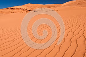 Desert. Dunset in desert. Desert in Dubai. Landscape of golden sand dune with blue sky in Sahara desert.