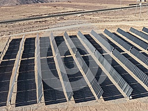 Desert fields filled with solar panels with solar tracking to maximize electricity generation