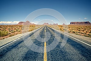 Desert highway leading into Monument Valley