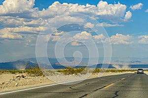 Desert highway to Death Valley National Park birth of a tornado