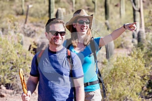 Desert Hiker Pointing with Friend