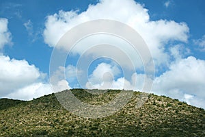 Desert hill and big clouds