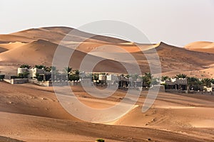 Desert Hotel, Abu Dhabi. Qasr Al Sarab Resort and Hotel in the Middle of Sand Dunes of Desert, Abu Dhabi, United Arab Emirates  photo