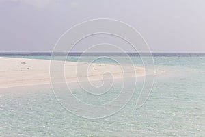 A desert island with a white sand in the Indian ocean Ari Atoll, Maldives