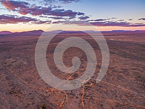 Desert land and Flinders Ranges peaks in the distance.