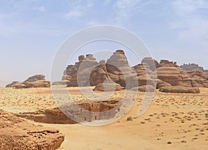 Desert landscape - basalt stone mountain / rocks and tomb entran