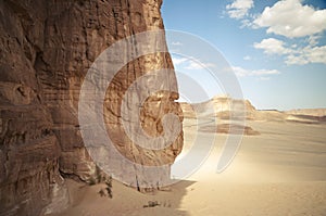 Desert landscape with blue sky and sun