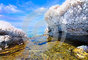 Desert landscape of Dead Sea coastline with white salt, Jordan, Israel.