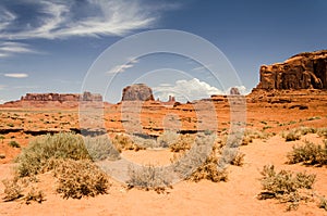 Desert landscape with red sand and mesas photo