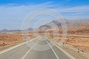 Desert landscape with rocks and geological formations on a hot summer day on the road from Kerman to Mashhad