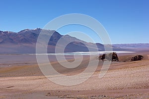 Desert landscape with snow peaks mountains of San Pedro de Atacama, Chile, South America.