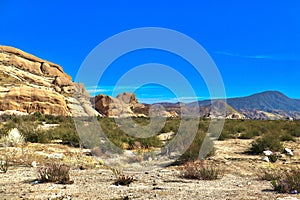 Desert landscape transitioning into dry rocky mountains