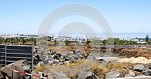 Desert landscape with urbanization in the background in Lanzarote