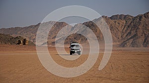 Desert landscape with the white jeep