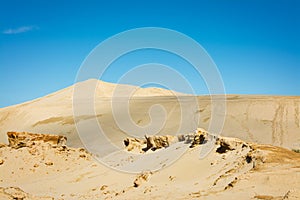 Desert-like landscape of the Giant sand dunes, Te Paki, on a beautiful summer day. Bizzarre sand formations and classic photo