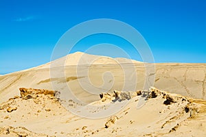 Desert-like landscape of the Giant sand dunes, Te Paki, on a bright summer day. Bizzarre sand formations and classic photo