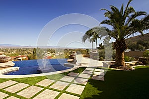 Desert mansion home back yard pool and fountains