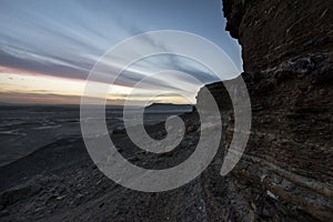 Desert mountain landscape with amazing sky after sunset at Jebel Dist