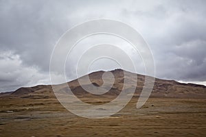 Desert-mountainous terrain . Blue sky with many white clouds. Desert and Mountain Landscape with Azerbaijan . Desert and blue sky