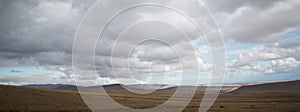 Desert-mountainous terrain . Blue sky with many white clouds. Desert and Mountain Landscape with Azerbaijan . Desert and blue sky