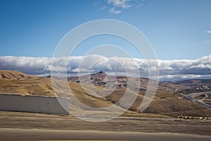 Desert-mountainous terrain . Blue sky with many white clouds. Desert and Mountain Landscape with Azerbaijan . Desert and blue sky