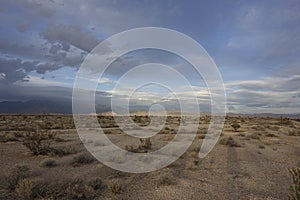 Desert with mountains before sunset