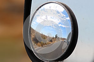 A desert reflection on the road