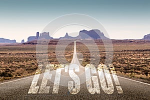 Desert road and let`s go sign