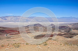 Desert road in National Park Death Valley, California USA