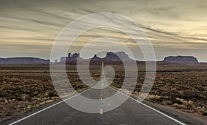 Desert road and rock formations