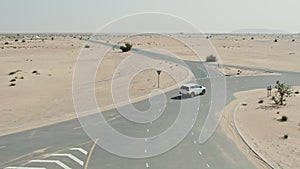 Desert road with sand dunes