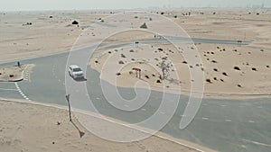 Desert road with sand dunes