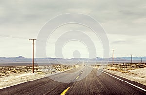 Desert Road With Telephone Poles