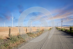 Desert Road through Wind Turbines Farm on California Hills