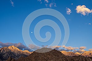 Desert rock formations with snowy mountain range in Eastern Sierra Nevadas California